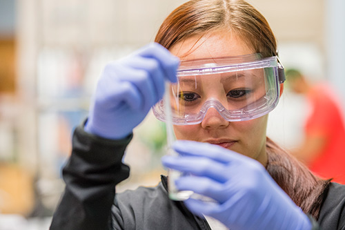 Female working in lab.