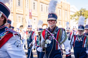 Jaguar Marching Band marching in Mardi Gras parade.