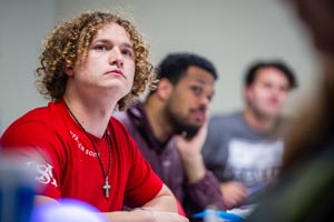 Students listening in classroom.
