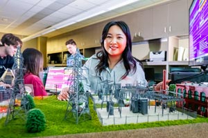 Student working with model in lab.