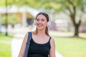 Student with headphones on.