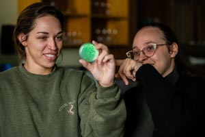 Students looking at sample in lab.
