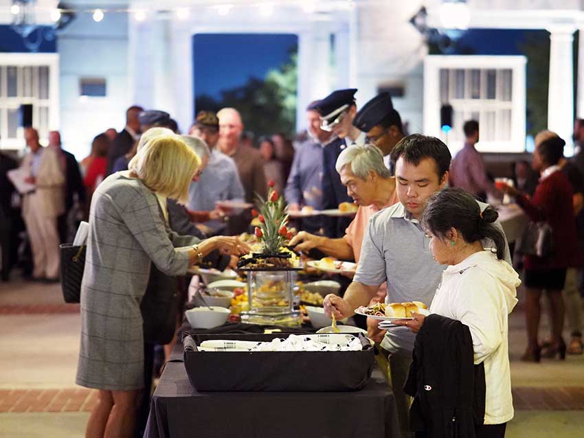 Group at food line at event.