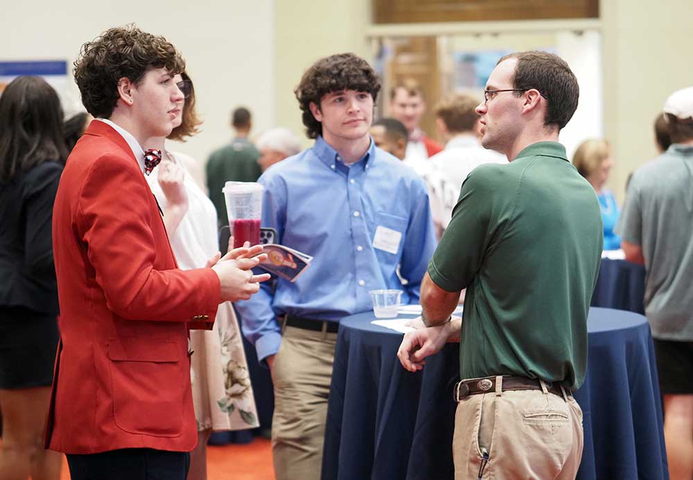 Southerner talking to participants of event.