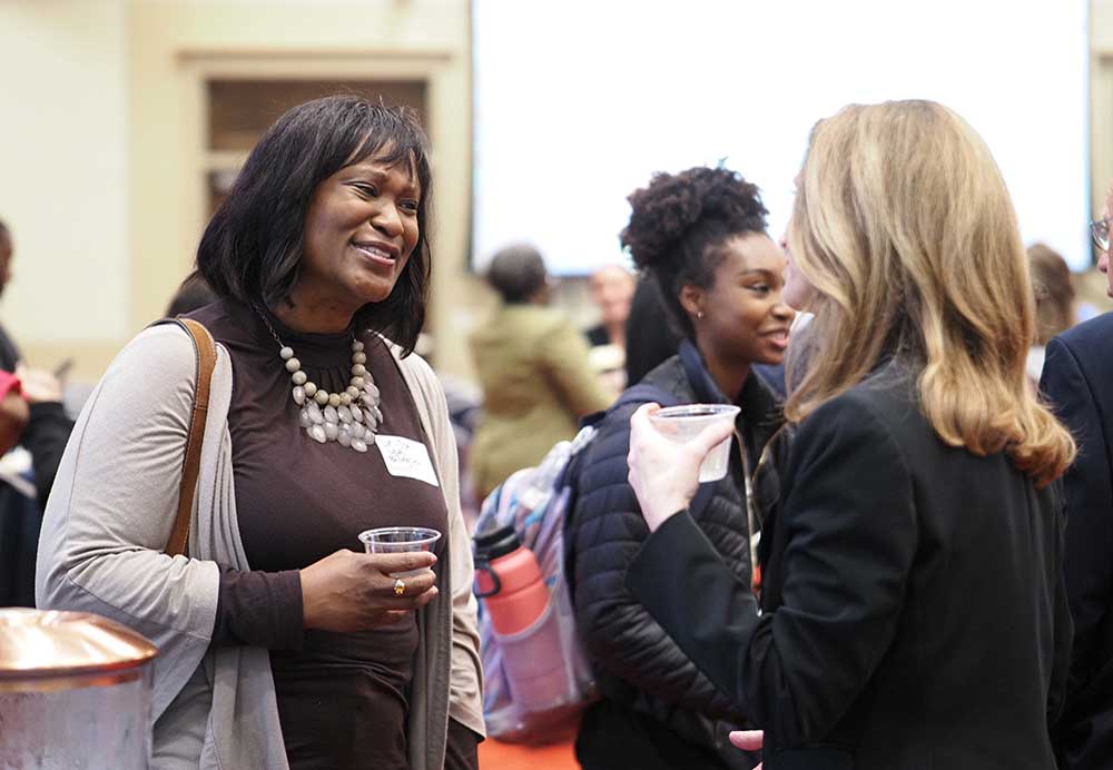 People socializing at event.