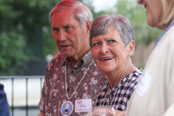 Older woman with short hair smiling.