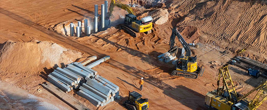 Machine moving dirt at job site.