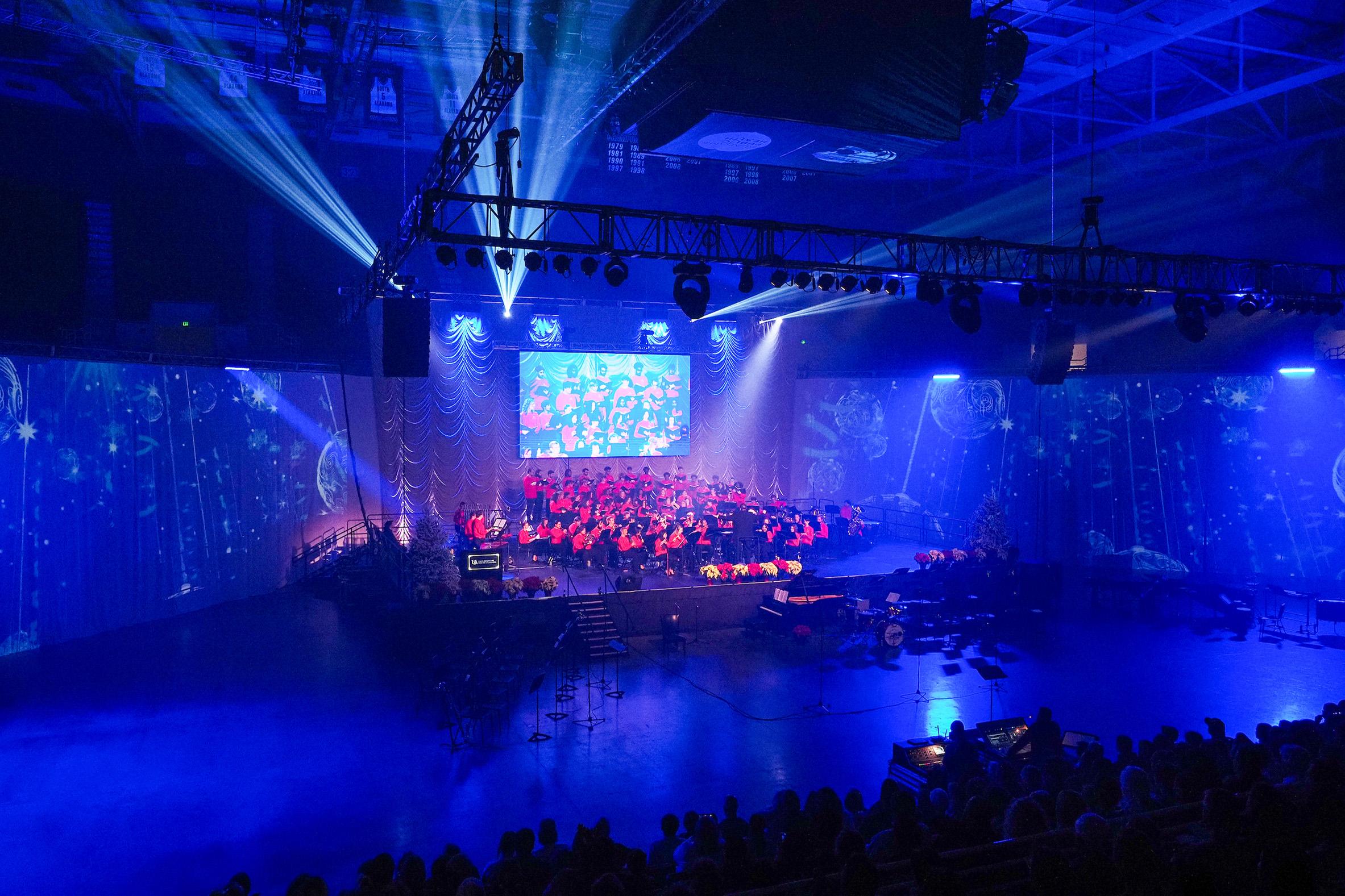 Student and faculty musicians in the University of South Alabama Department of Music performed at USA's annual Holiday Concert on Dec. 5, 2024 at the USA Mitchell Center showing stage with audience.