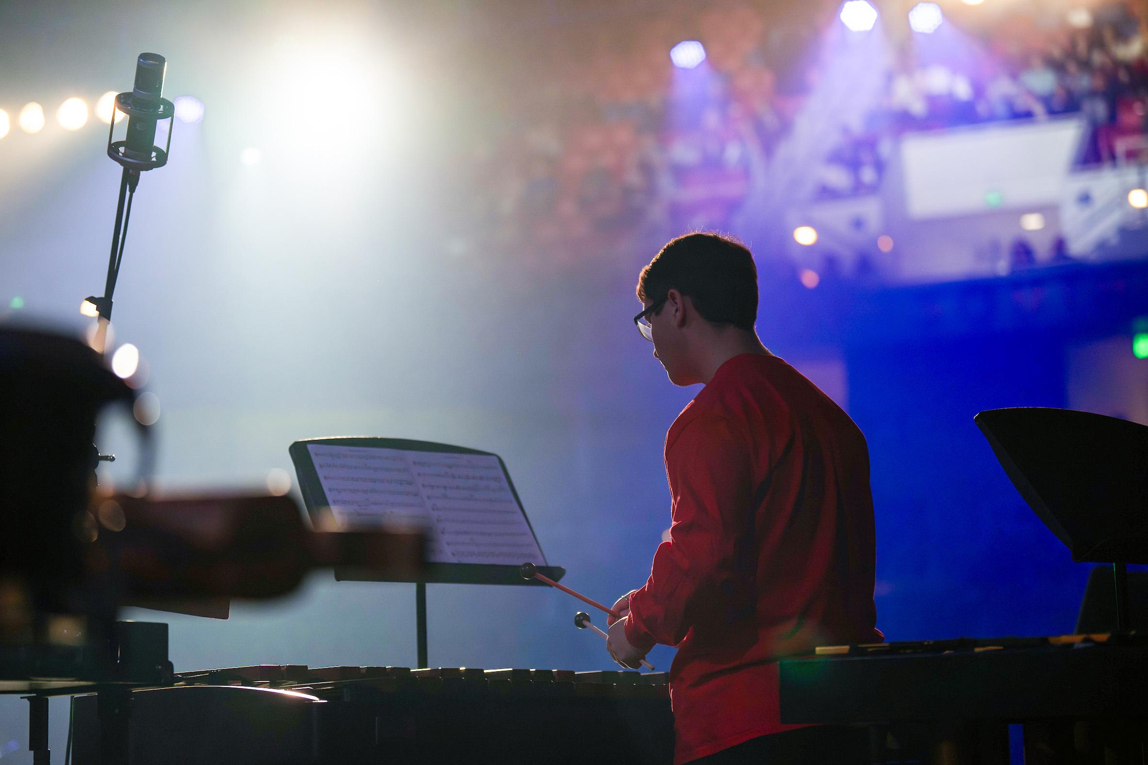 Performer at concert playing.