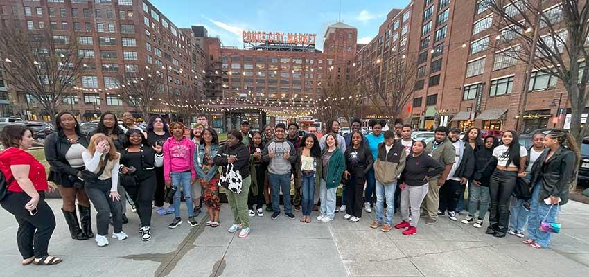 Large group of students in front of Ponce City Market.