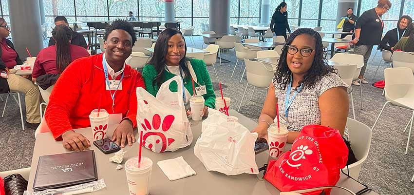 Student eating Chick fil a.