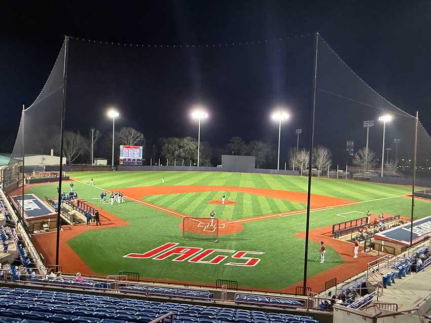 Stanky Field  at night with players on field.