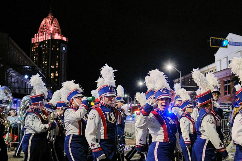 Jaguar Marching Band waving and smiling