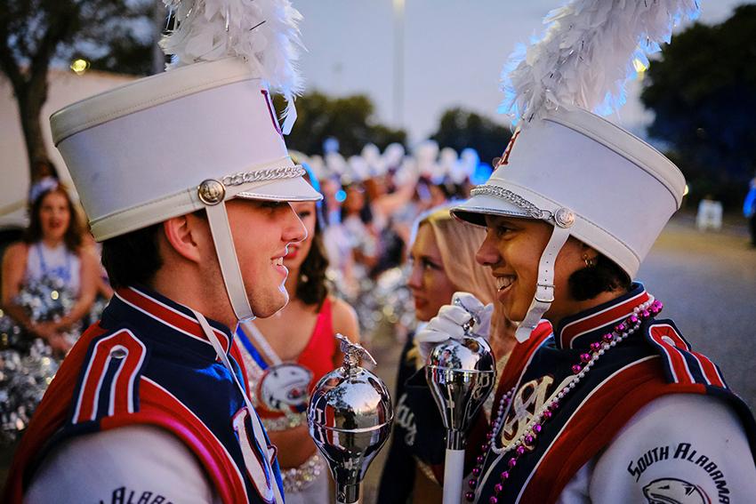 Jaguar Marching Band member smiling at each other