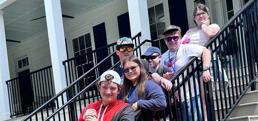 PEP students on staircase.