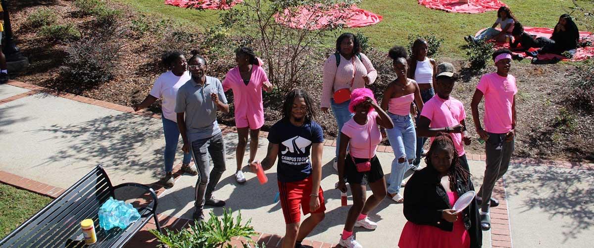 BSU students at a gathering in pink.