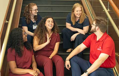 Allied Health students in healthcare uniforms.