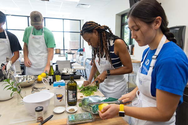 Students at the Whiddon College of Medicine take a class in Culinary Medicine.