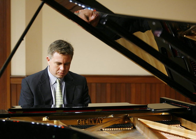 Dr. Robert Holm playing piano