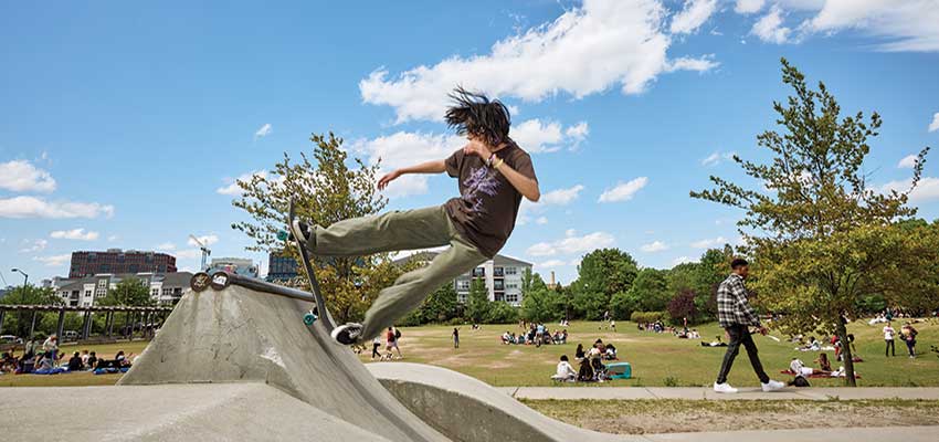 Person on skateboard at skatepark.