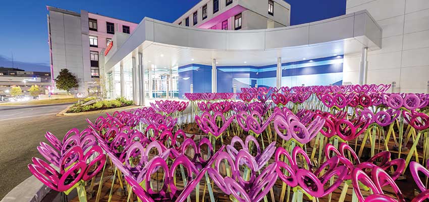 Flower sculpture in front of USA Health Children’s & Women’s Hospital.