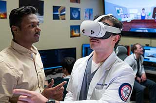 Student wearing VR in classroom.