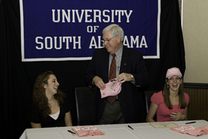 New York's Junior Miss Brynn Armstrong, USA President Gordon Moulton, and Wisconsin's Junior Miss Kaila Mattson