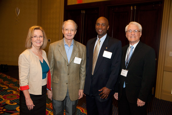 At the conference are, from left, American Petroleum Institute Senior Economic Advisor Rayola Dougher; Mobile businessman and philanthropist Abraham Mitchell; FDIC Division of Insurance and Research Manager Marlon Cook, and USA Mitchell College of Business Distinguished Professor and Director of the Center for Real Estate Studies Dr. Donald Epley.