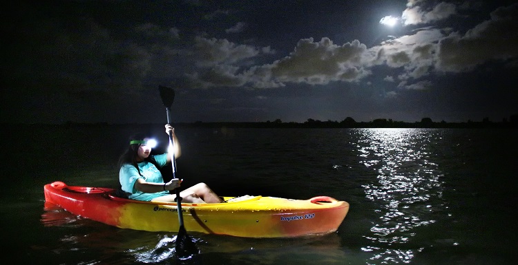 Tuesday Scott, a freshman in biomedical sciences, paddles on the Apalachee River in the lower Mobile-Tensaw River Delta during the August Outdoor Adventures full-moon paddle.