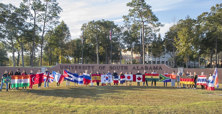 Students representing their home countries gather for a group photo as part of International Education Week. 