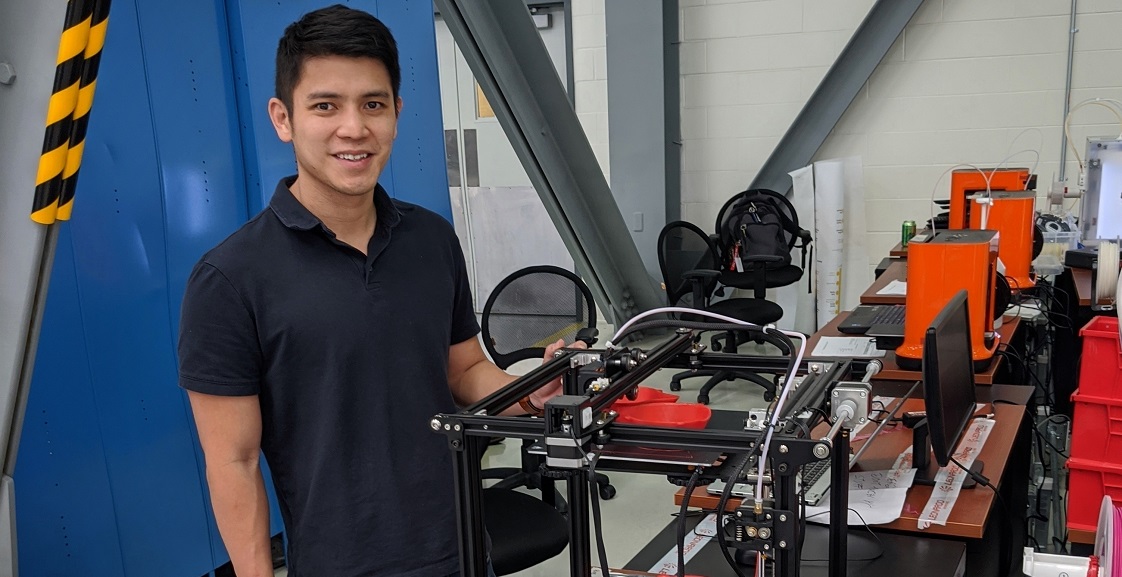 John Ding, who earned a master's in business administration from the University of South Alabama's Mitchell College of Business, is an aircraft engineer at Airbus and part of a team making medical masks for USA Health using 3D printers. Photo courtesy of Airbus. 