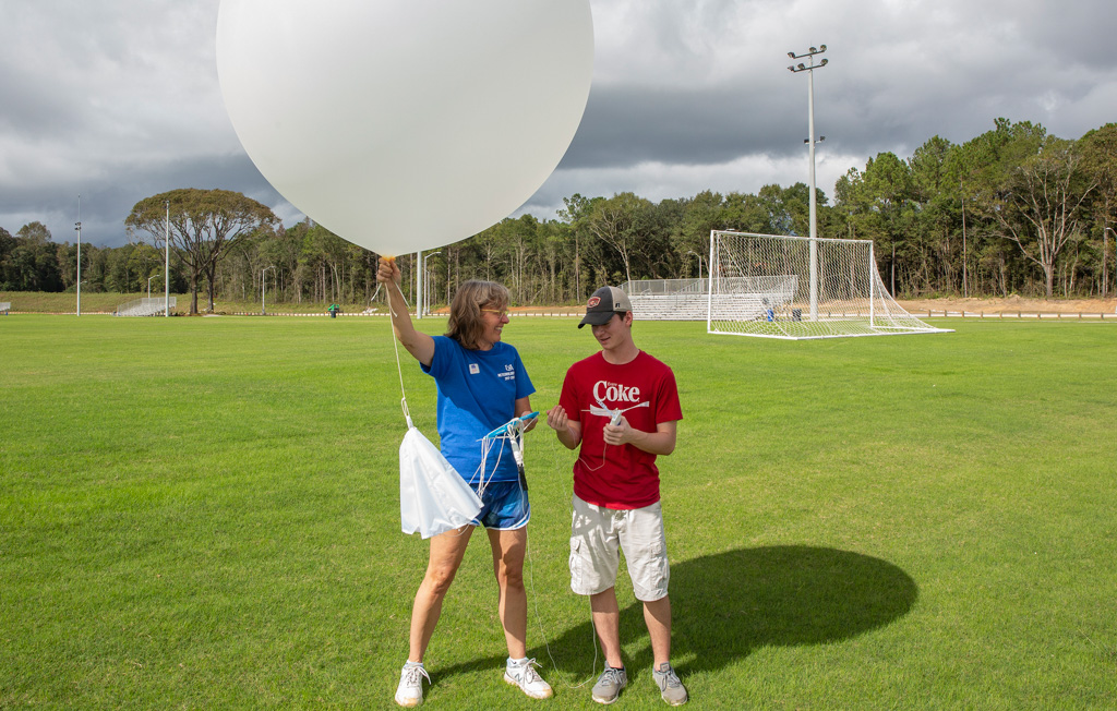 Dr. Sytske Kimball holds weather balloon