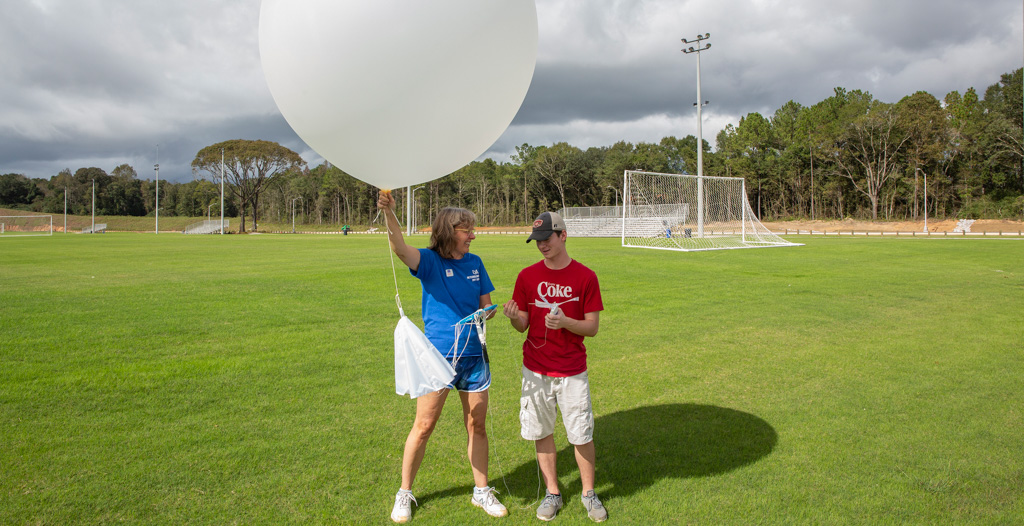 Dr. Sytske Kimball holds weather balloon