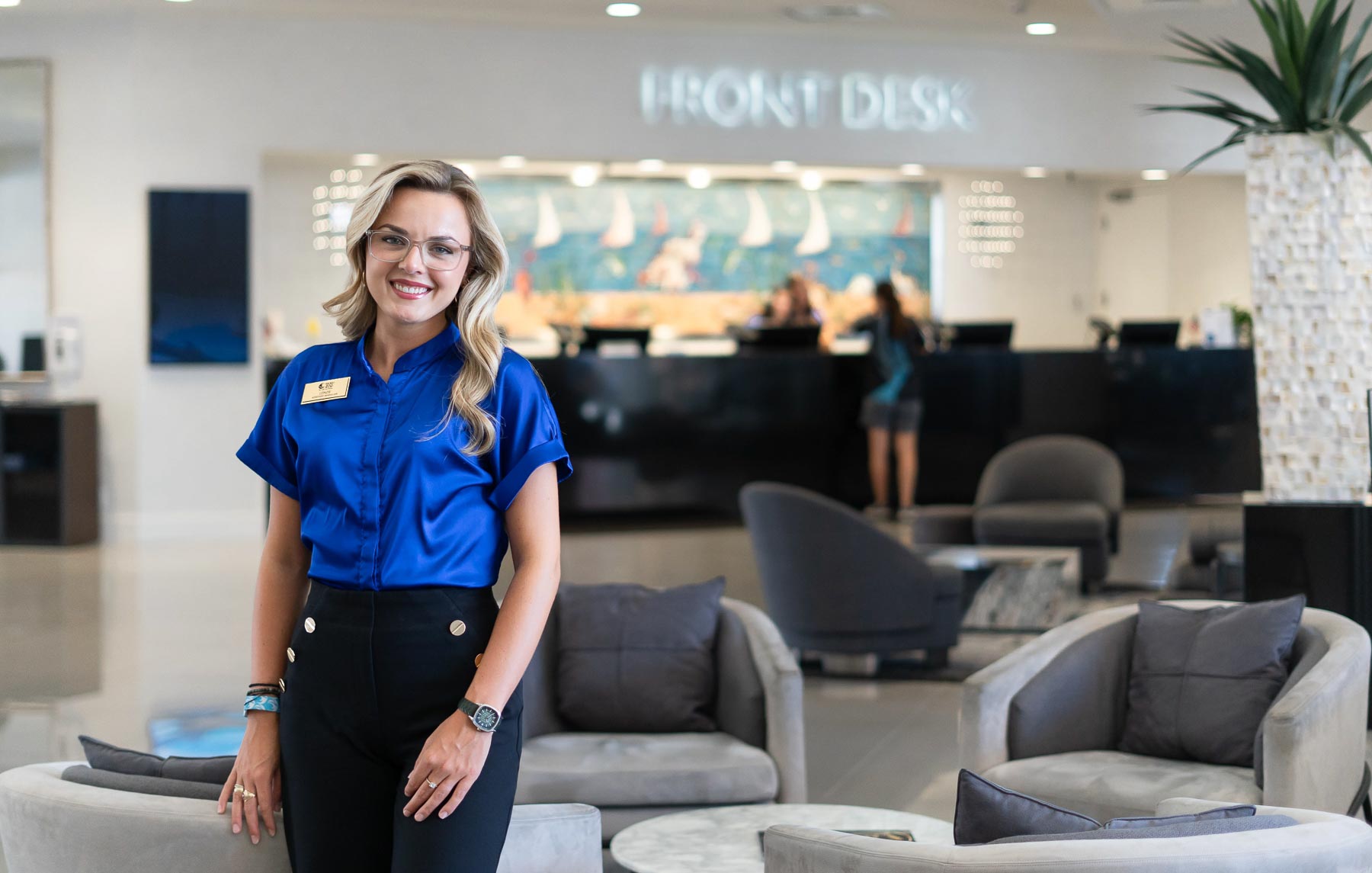 Lenzie Richardson, who graduated in hospitality and tourism management from the University of South Alabama, at the Perdido Beach Resort near the front desk, where she is an assistant manager.