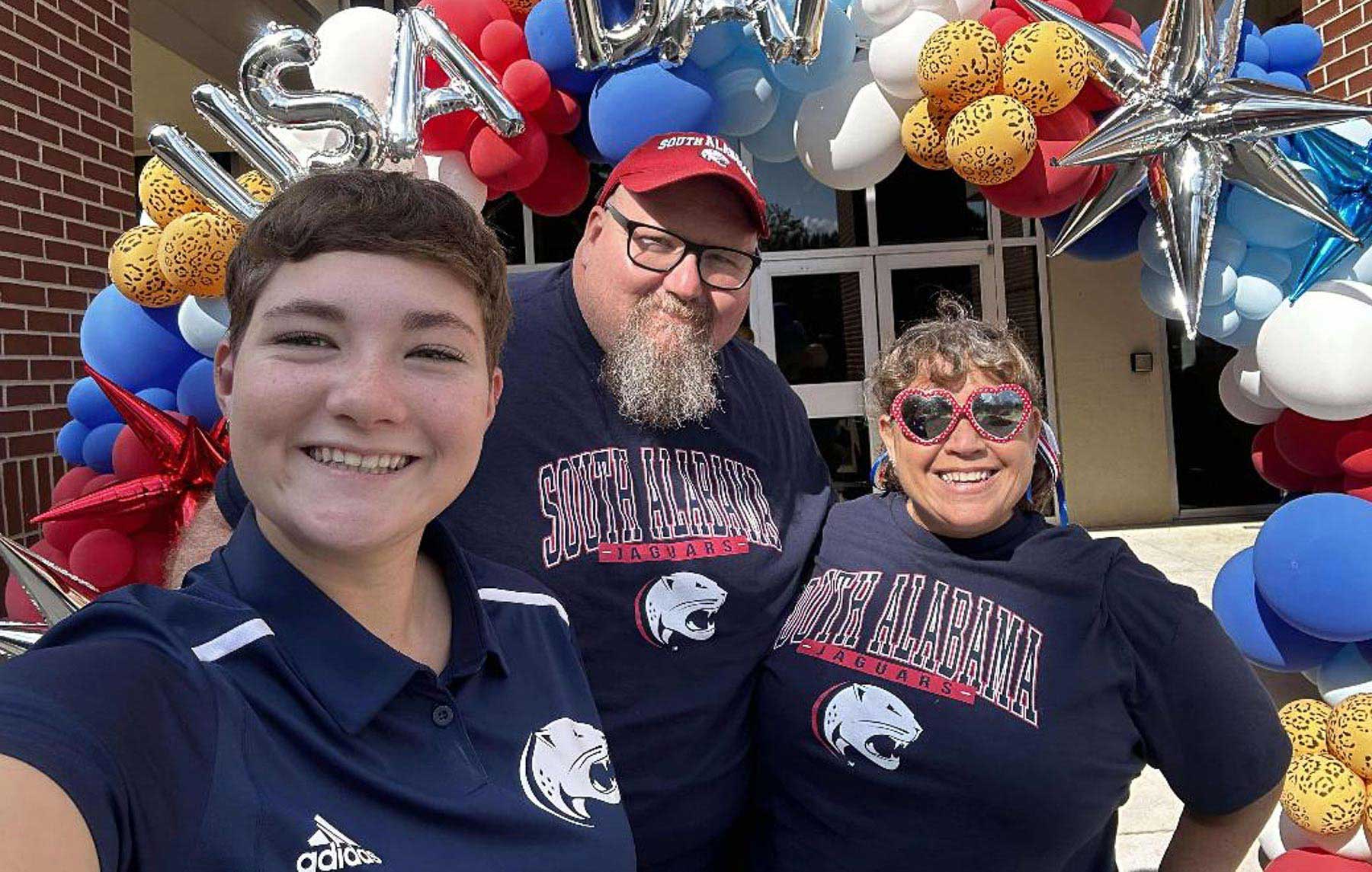 Lilly Johnson, with her parents, Cliff and Sarah, at USA Day. 