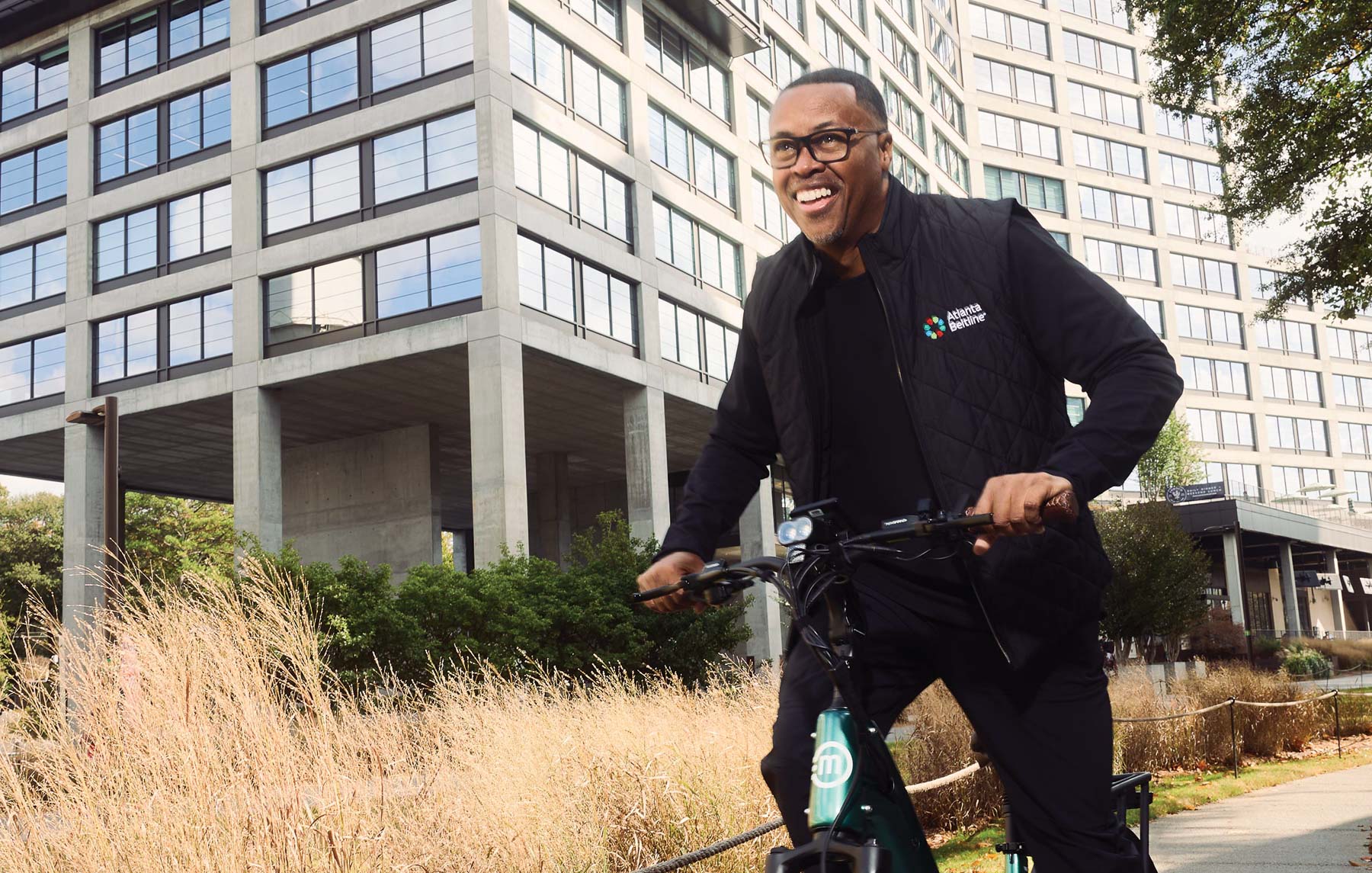 Clyde Higgs ’97, president and CEO of the Atlanta Beltline, bikes on the Beltline, one of the nation’s largest and most wide-ranging urban redevelopment programs.