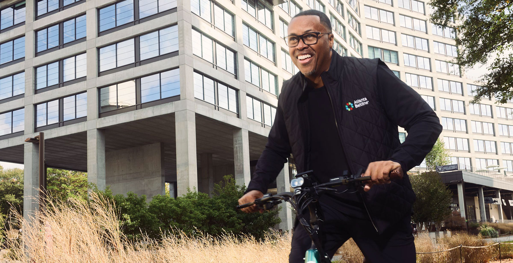 Clyde Higgs ’97, president and CEO of the Atlanta Beltline, bikes on the Beltline, one of the nation’s largest and most wide-ranging urban redevelopment programs.