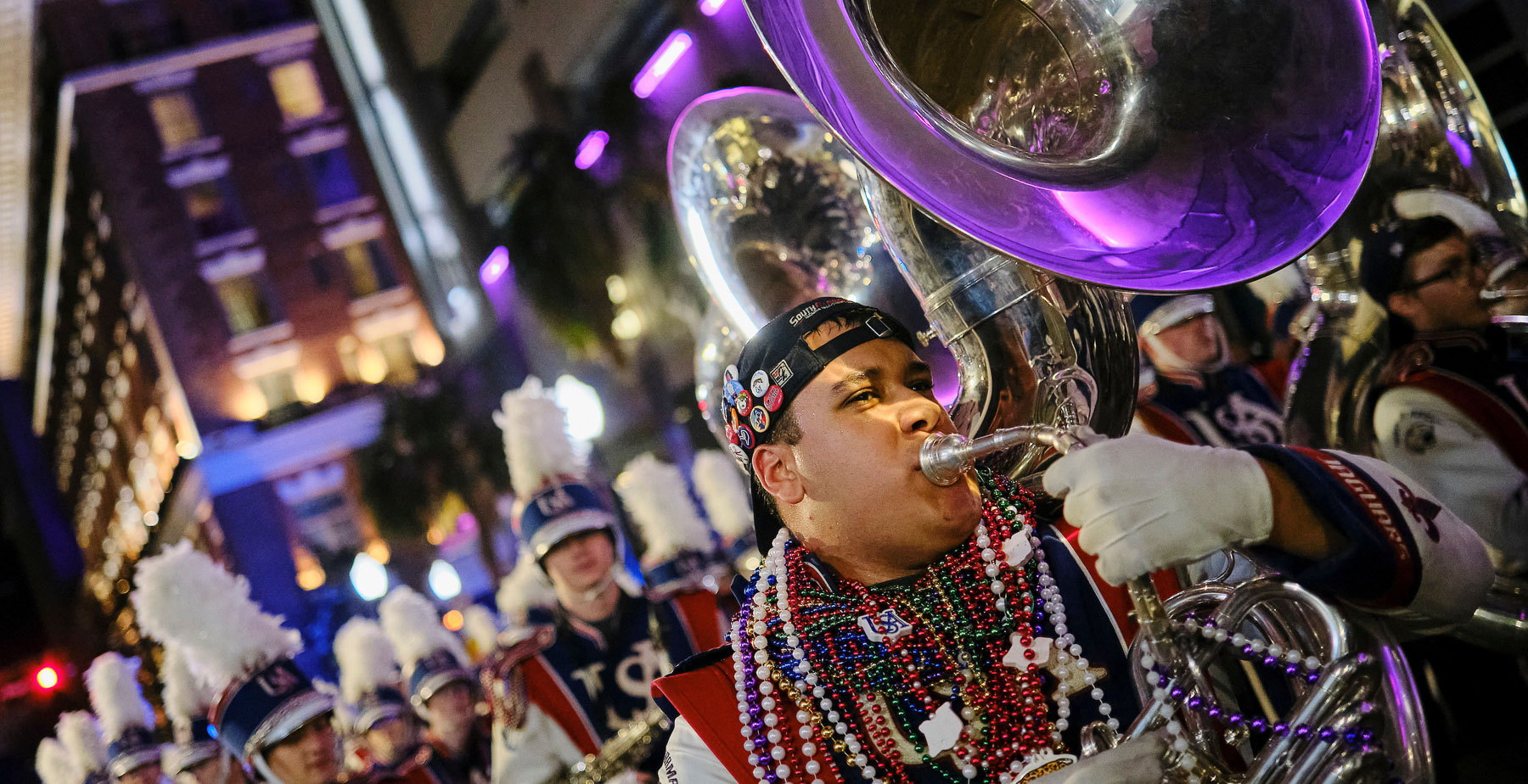 The Jaguar Marching Band marching with the Conde Cavaliers in downtown Mobile on Friday, Feb. 14, 2025.