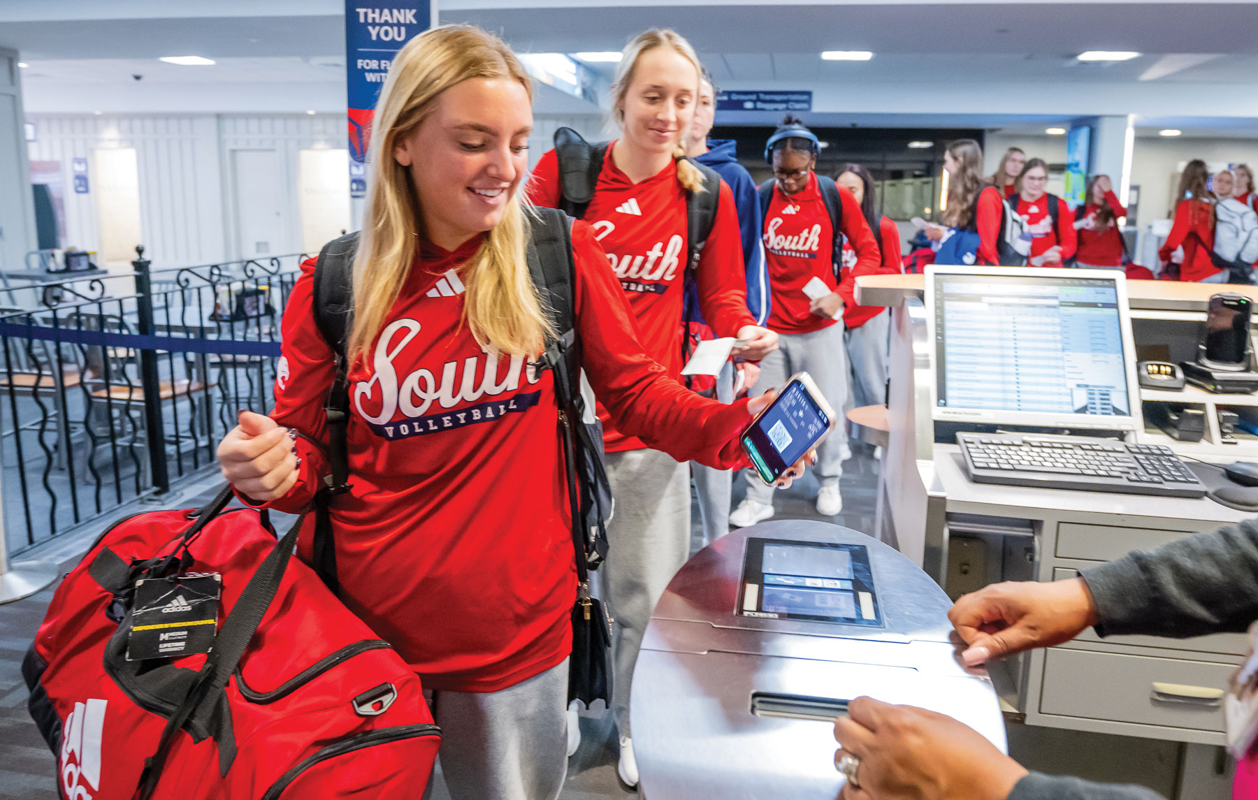 At 5:42 on Oct. 31, the volleyball team boards a flight at Mobile Regional Airport on their way to a two-match sweep of James Madison University in Harrisonburg, Virginia. 