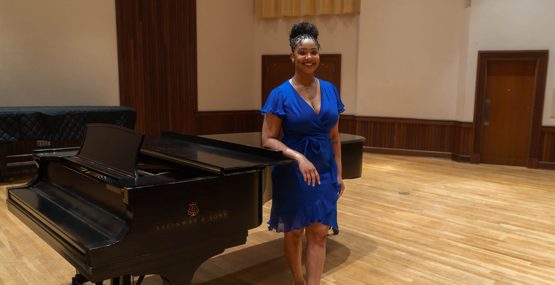 Desirée Whitehead, a soprano vocal performance senior, participated in a companywide singing competition hosted by her home improvement store employer. She was the vocal centerpiece of a classical trio called Symphony of Dreams, winning first place in the Las Vegas finals.