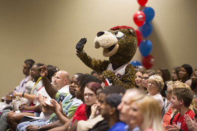 Family members with mascot at new student orientation