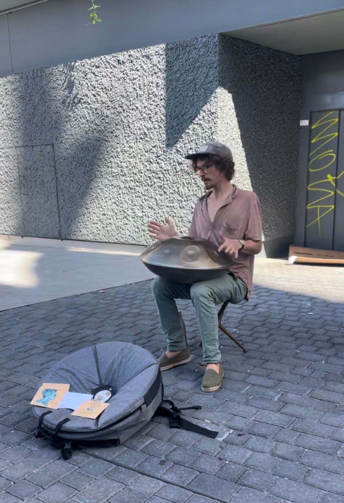 man performing on the cobblestone street in Spain